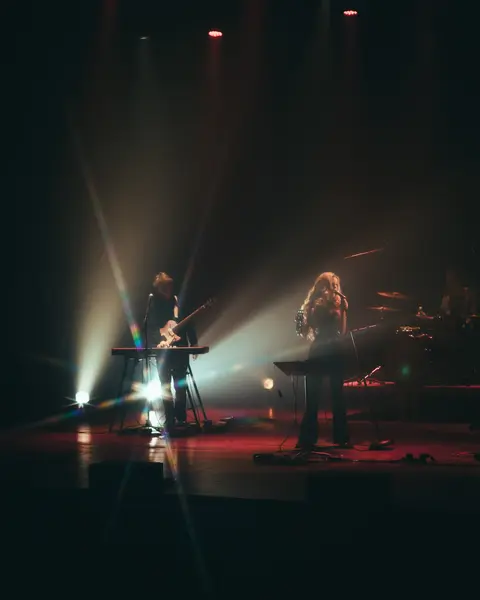 Devil of a Woman live under stage lights